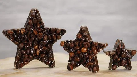 Three Coffee Bean Stars Representing Quality and Excellence Stock Photos