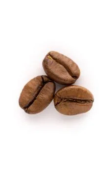 Three coffee beans on a white background. Isolated. Macro photo Stock Photos