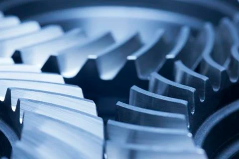 Three cog wheels working together in an engine Stock Photos