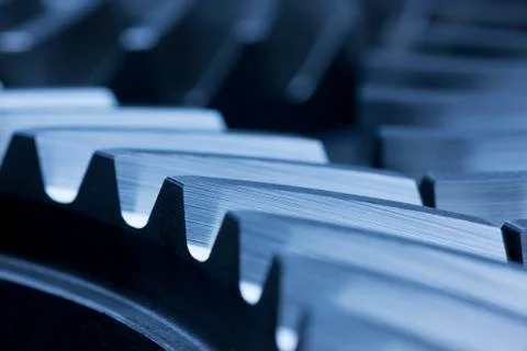 Three cog wheels working together in an engine Фото