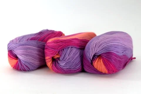 Three coils of sectional yarn for needlework on a white background Stock Photos