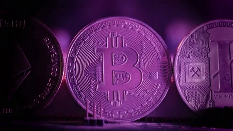 Three coins of popular cryptocurrencies. Macro. Blue neon colors. Stock Footage 147087681