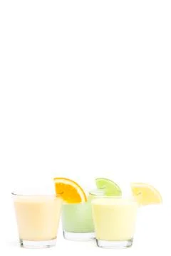 Three cold citrus fruit milkshakes Stock Photos