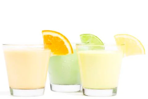 Three cold citrus fruit milkshakes Stock Photos