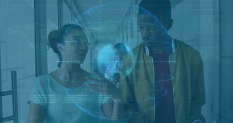 Three colleagues collaborating in tech office, interacting with 3D globe Stock Footage 308654603
