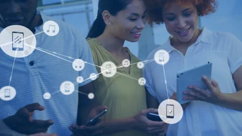 Three colleagues glancing at devices, causing floating icons and nodes 動画素材 317600402