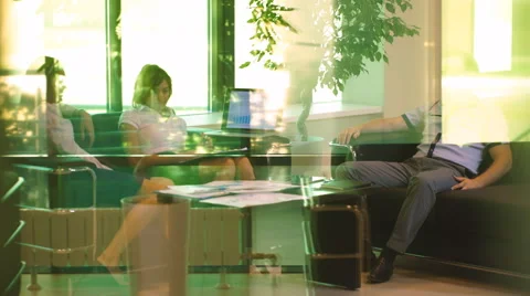 Three colleagues going to lunch in the lobby of the office Stock Footage 67383537