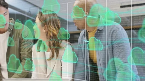 Three colleagues leaning, pointing at desk as teal cloud overlay rising, driving Stock Footage 333494249
