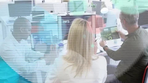 Three colleagues reviewing data, right man pointing report and causing overlays Stock Footage 333425595