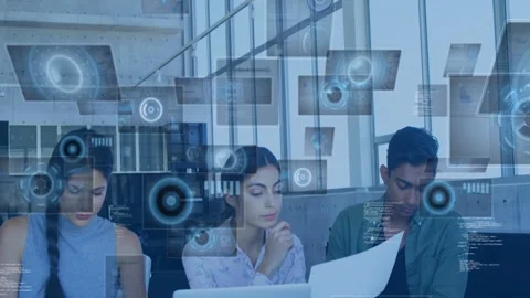 Three colleagues sitting at table, camera panning showing laptop and docs, HUD Stock Footage 332566363