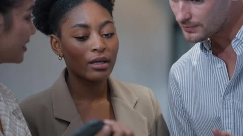 Three colleagues, talking together at modern office. Business, teamwork concept. Stock Footage 250598544