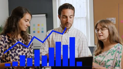 Three colleagues tapping laptop, analyzing sales and planning steps, chart Stock Footage 333477771