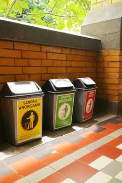 Three Color Coded Waste Bins For Proper Waste Sorting 库存照片
