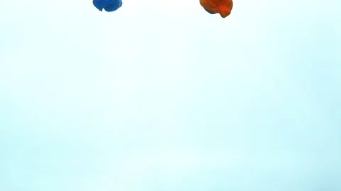 Three color paint mixed under water on white Stock Footage 119371742