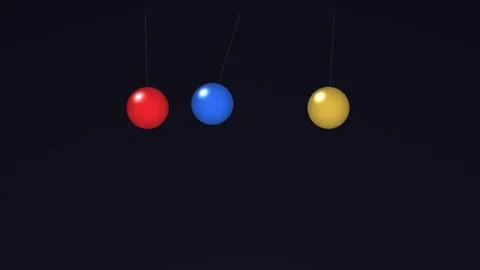 Three colored balls swinging in a dark space Stock Footage 338232604
