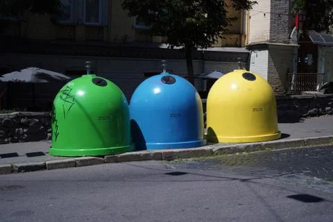 Three colored bins for sorting waste located in the city on the street.Trash Foto stock