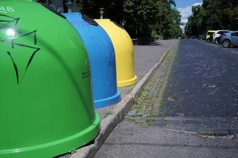 Three colored bins for sorting waste located in the city on the street.Trash 写真素材