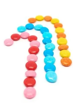 Three colored candies isolated on white background vertical format Stock Photos