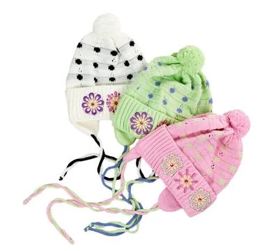 Three colored children s knitted hat with a flower pattern three colored c... Stock Photos