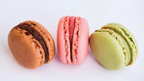 Three colored macaroons on white background Stock Photos