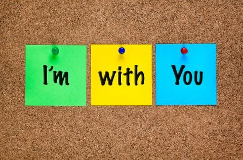 Three colored notes on cork board with words Im with You. Stock Photos