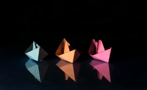 Three colored paper boats Stock Photos