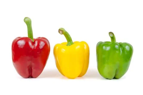 Three colored peppers on white background Stock Photos