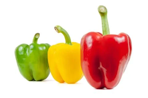 Three colored peppers on white background Stock Photos