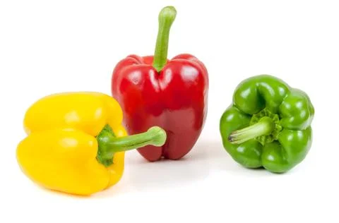 Three colored peppers on white background Stock Photos