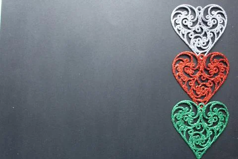 Three colored silver red fishnet colours on a black background with a copyspa Stock Photos