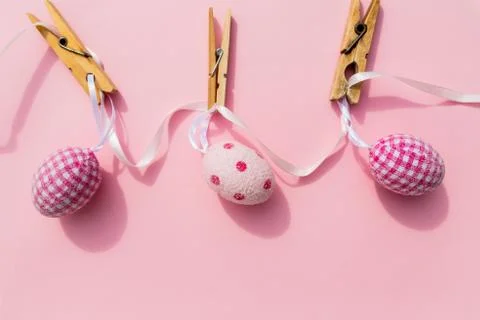 Three colorful easter eggs isolated on pink backgrund.set of Easter eggs.Hand Stock Photos