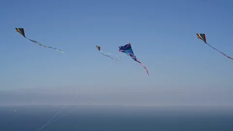 Three colorful kites in the wind Stock Footage 89622535
