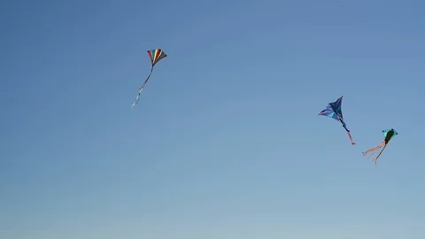 Three colorful kites in the wind Stock Footage 89622644