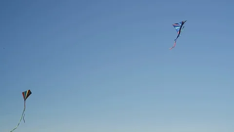 Three colorful kites in the wind Stock Footage 89622734