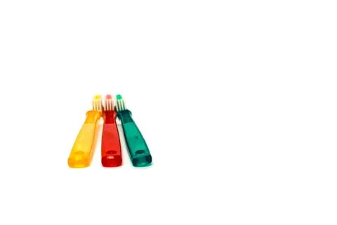 Three Colorful Toothbrushes on a White Background, Studio Shot for Dental H.. Stock Photos