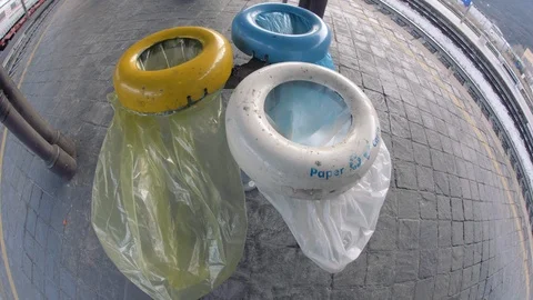 Three colors recycling bins at a train station in Italy. Plastic, paper, trash Vídeos de archivo 112716310