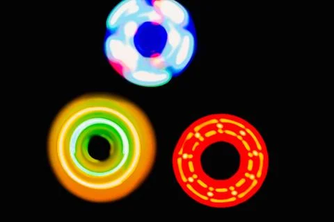 Three Colourful circle light in dark background Stock Photos