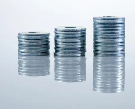 Three columns graph of aluminium screw washers. Stock Photos