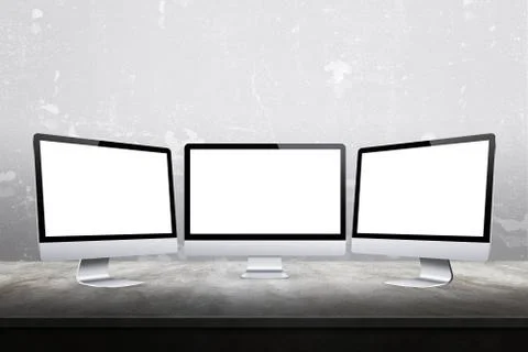     Three computer displays with isolated white screen for mockup Stock Photos