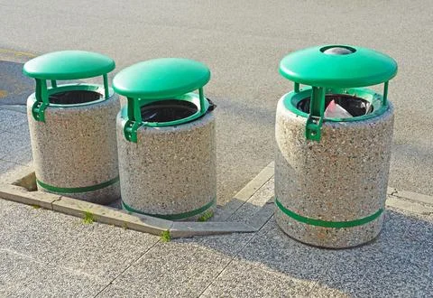 Three concrete dumpsters Stock Photos