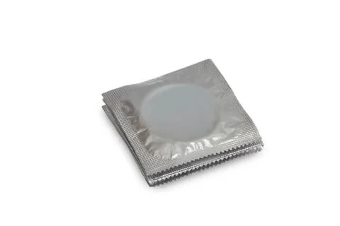 Three condoms in silver packing Stock Photos