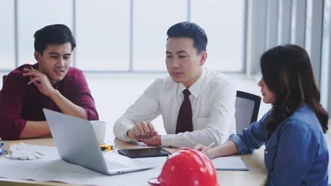 Three Construction contractor Business team is discussing on laptop computer in  Stock Footage 138976987