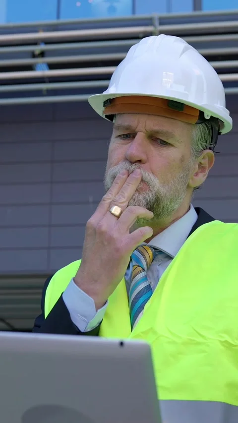 Three construction engineers having a discussion on building site. Stock Footage 312263299
