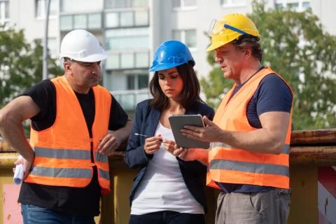 Three construction workers Stock Photos