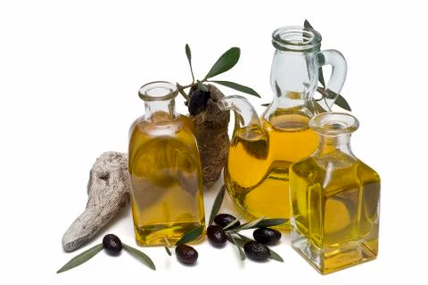 Three containers with olive oil. Stock Photos