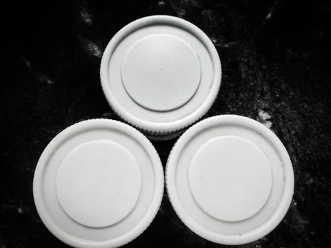 Three containers placed in a table making a triangle shape. Stock Photos