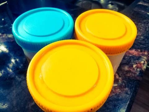 Three containers placed in a table making a triangle shape. Stock Photos