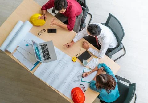 Three contractor builder team having a successful meeting in office, Top view Stock Photos