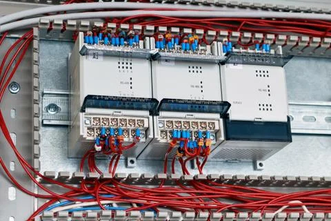 Three controllers or devices are fixed in the electrical Cabinet. Foto stock