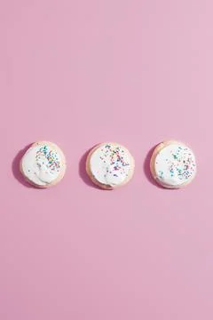 Three cookies on pink Stock Photos